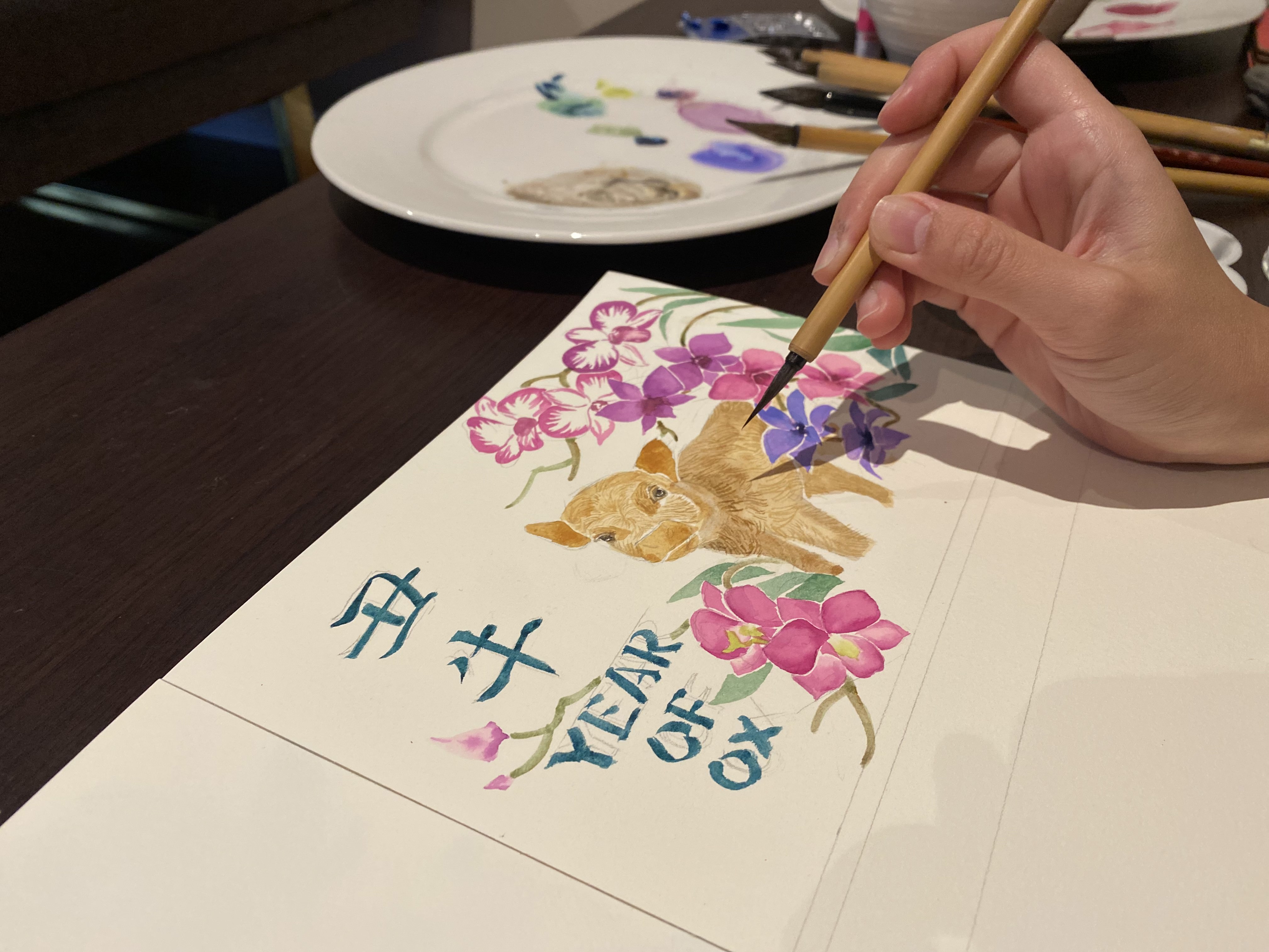 Ox painting Artist Silka Huang working on the Year of the Ox painting