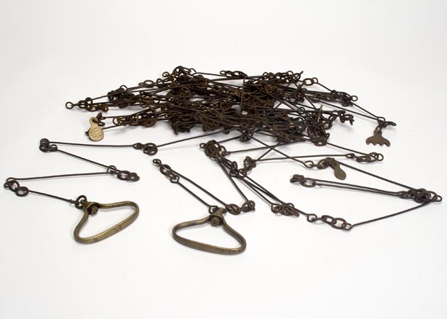 Chain used to measure distance composed of 100 metal links fastened together with rings