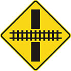 yellow diamond-shaped sign with black line and rail tracks showing what angle they intersect the road