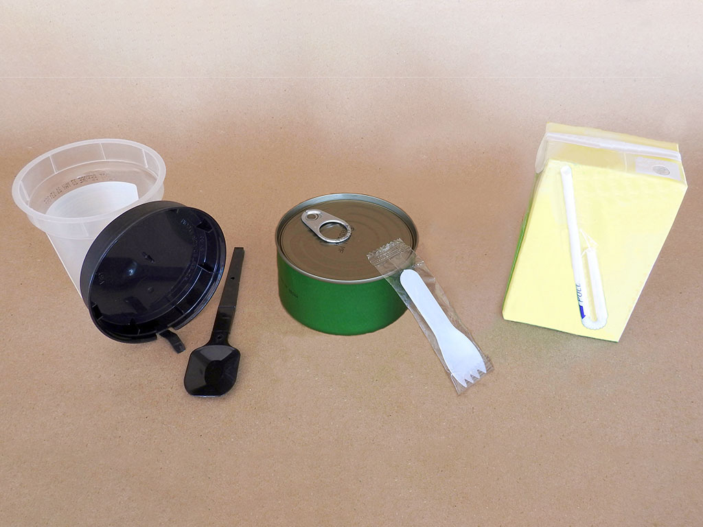 Straws and cutlery attached to a shelf-ready, pre-packaged items