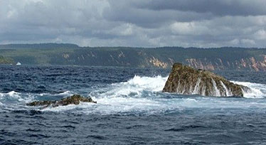 Image of Wolf Rock, near Double Island Point in Queensland, is a protected grey nurse shark aggregation site.