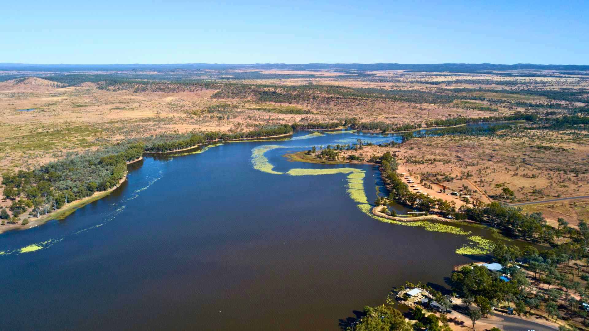 Aerial view of Theresa Creek Dam with winding inlets and bushland.