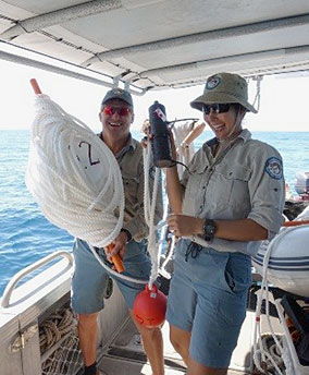 Image of QPWS Rangers standing by for deployment of ropes, chains, floats, 'sync tags' and receivers.