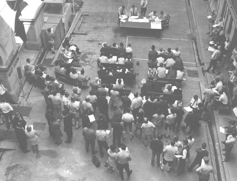 Oblique aerial view of a crowd attending a land ballot draw in the 1960s.