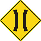 yellow diamond-shaped sign with 2 parallel black lines that veer toward each other slightly and then away again