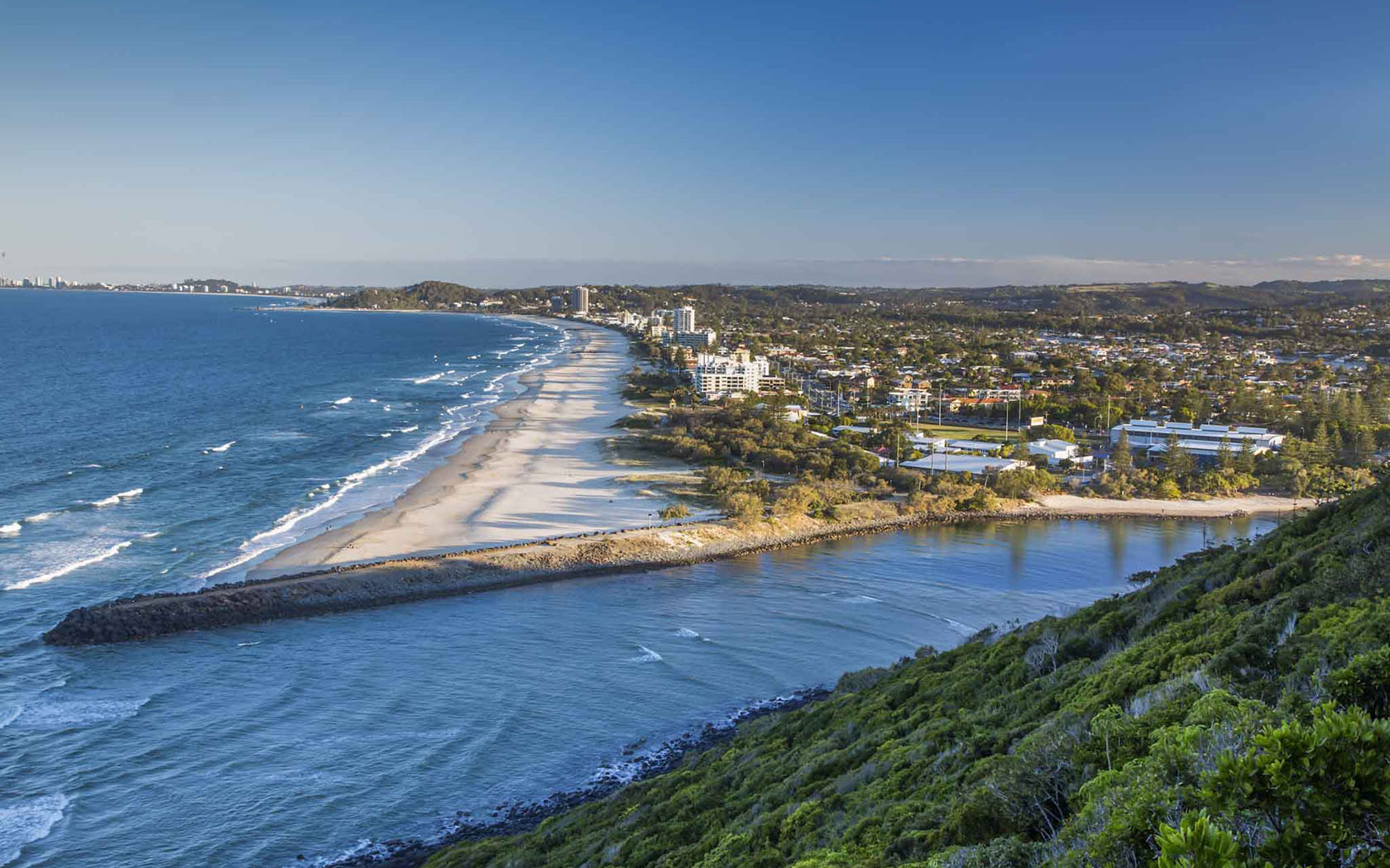 Aerial view of the Gold Coast coast line and the buildings at the Gold Coast Recreation Precinct.