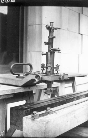 Microscope used with an octagonal bar to check steel measuring tapes