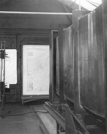 Hunter Penrose camera ready to take a photograph of a map