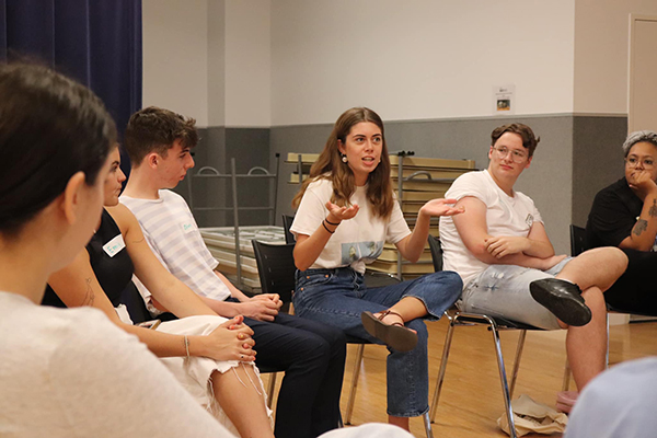 Group of people talking at the Gold Coast Speak out series event