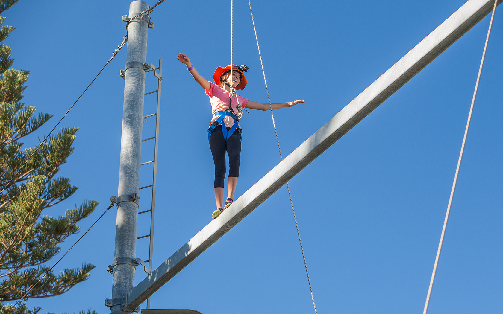 A child on the aerial ropes course.