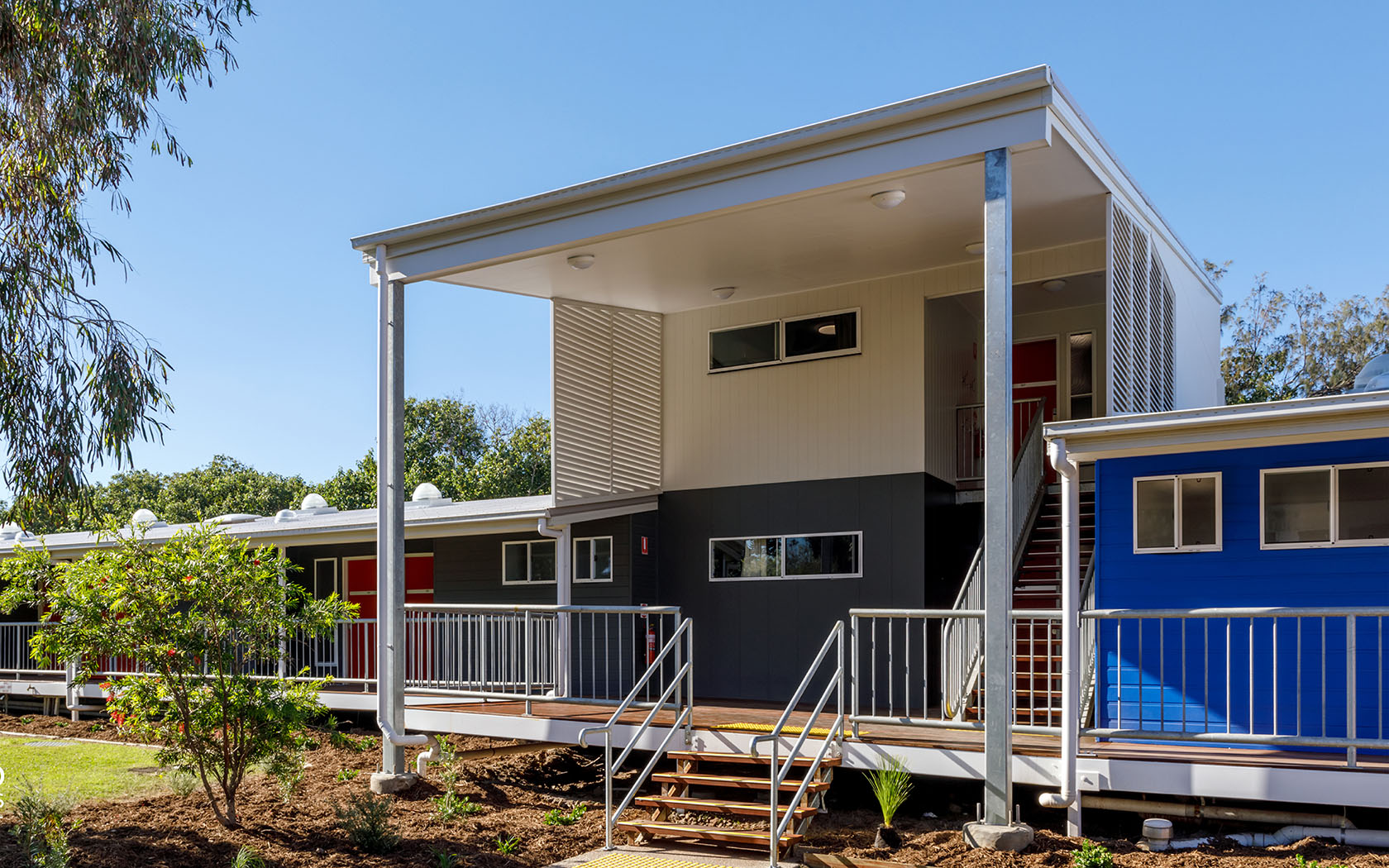 Exterior view of an accommodation building with stairs at the front.
