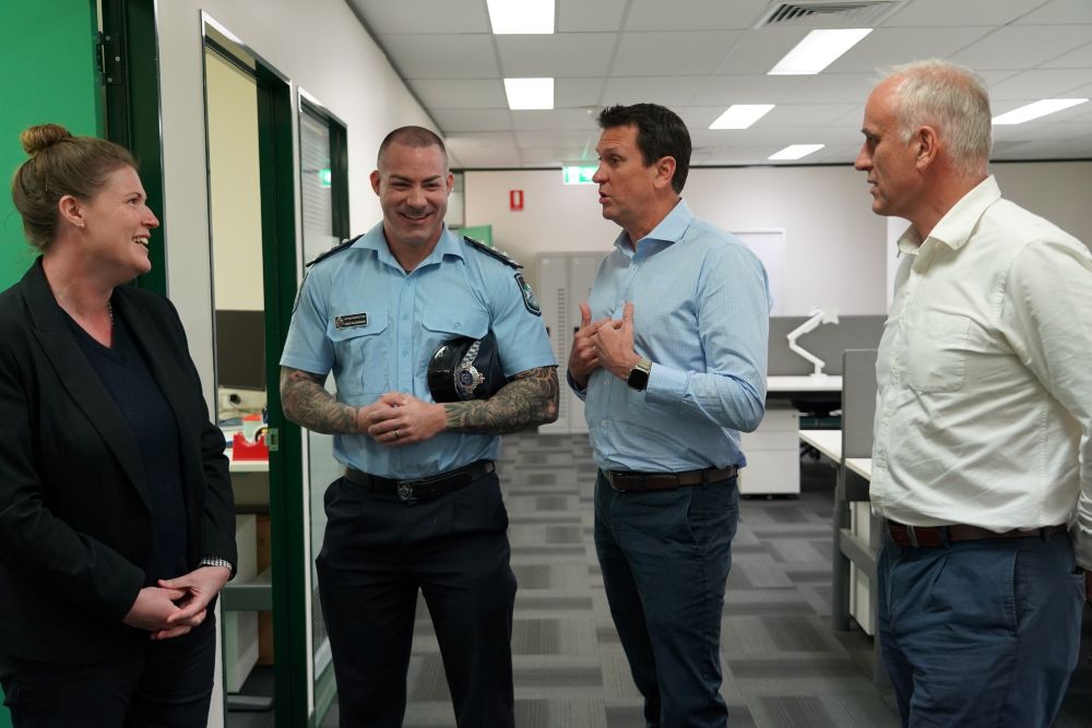 Acting Detective Sergeant Bradnam and Acting Inspector Hildebrand in conversation with the Minister for Police and Emergency Services and the Member for Mackay at Mackay Police Station