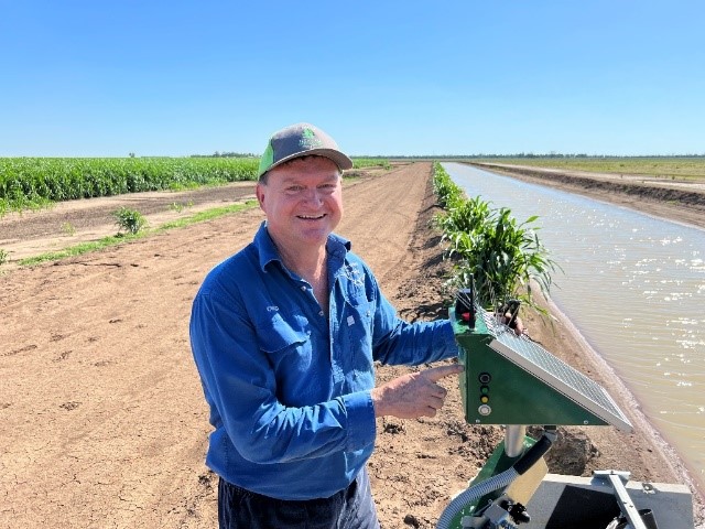 Craig Saunders of Saunders Farm, St George Farmer standing in front of water