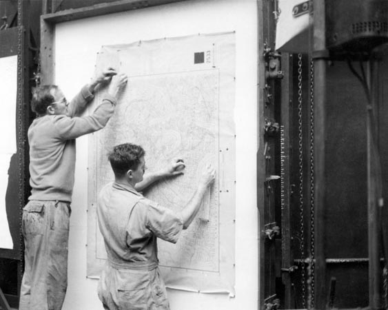 Preparing a map on the copy board for photographic reproduction by the Hunter Penrose camera