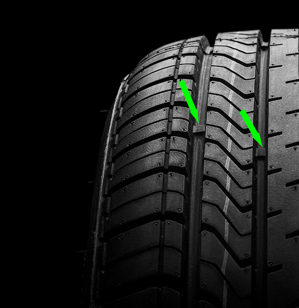 A new tyre with wear indicators well below the tyre surface