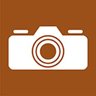 brown sign with a camera icon