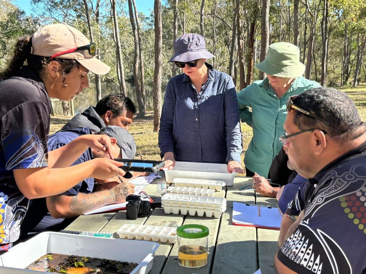 Ranger group practising techniques for water testing.
