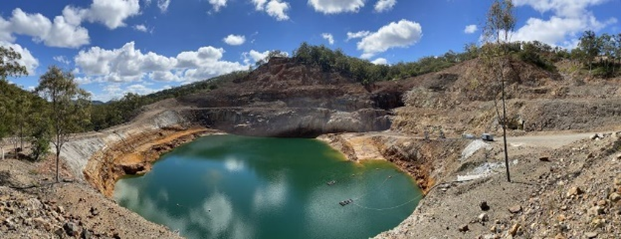 Open-cut pit with lowered water level due to water treatment and evaporation