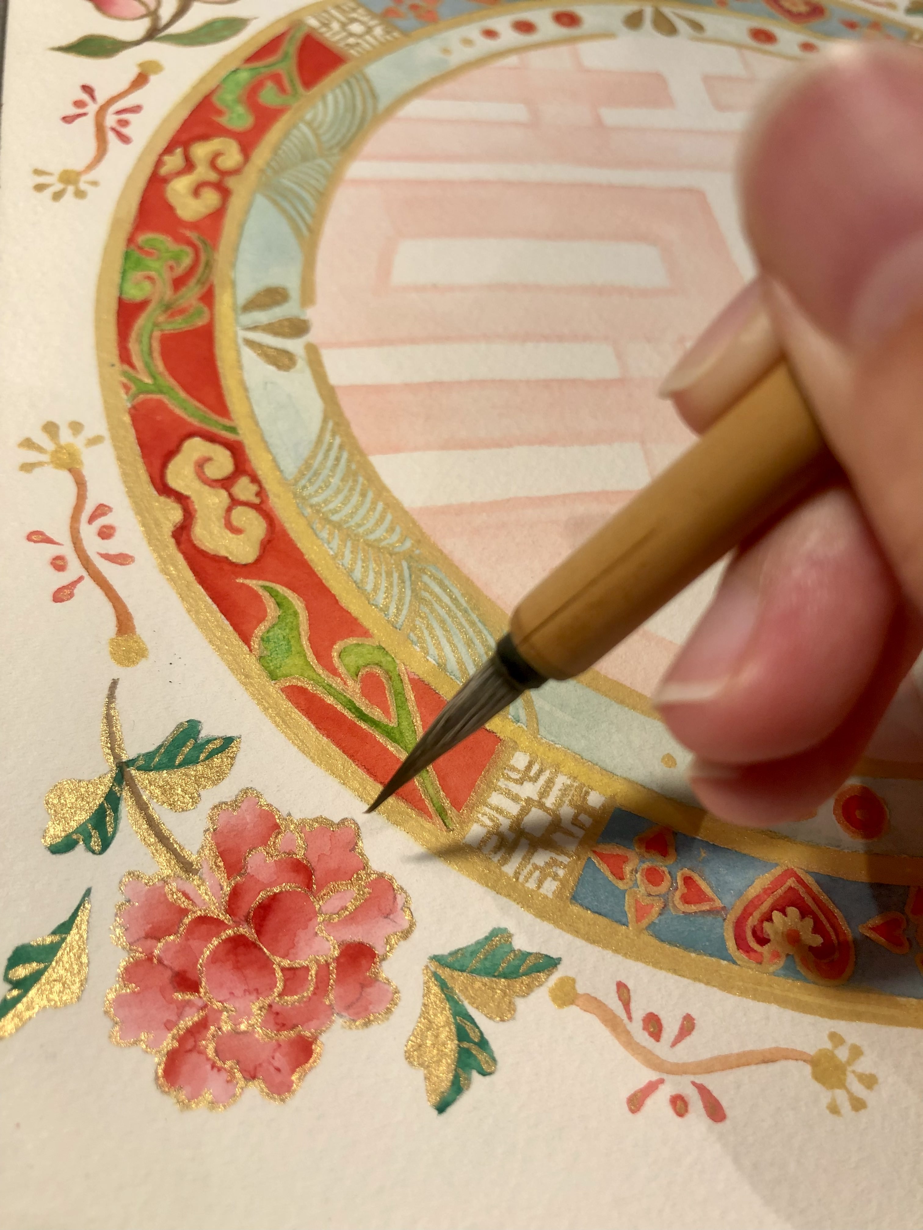 Peony - double happiness Artist Silka Huang working on the peony element of the design.