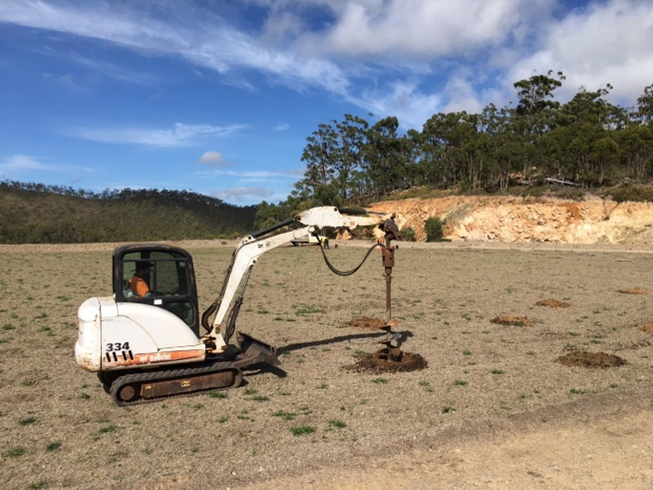 Machinery digging holes for tubestock