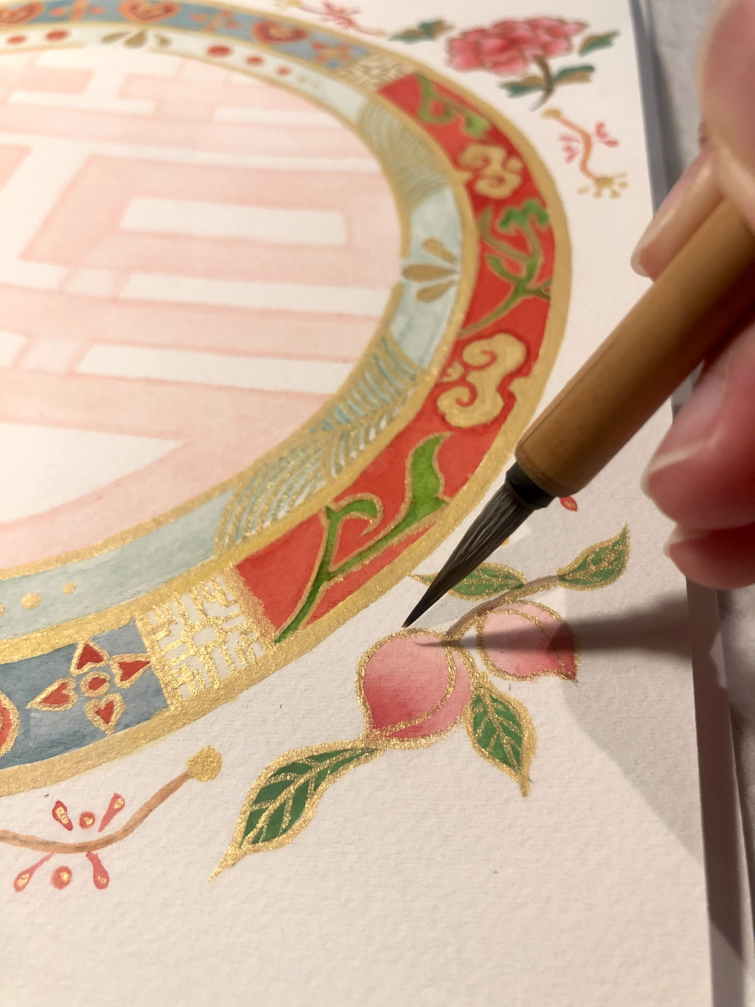 Peach - double happiness Artist Silka Huang working on the peach element of the design.