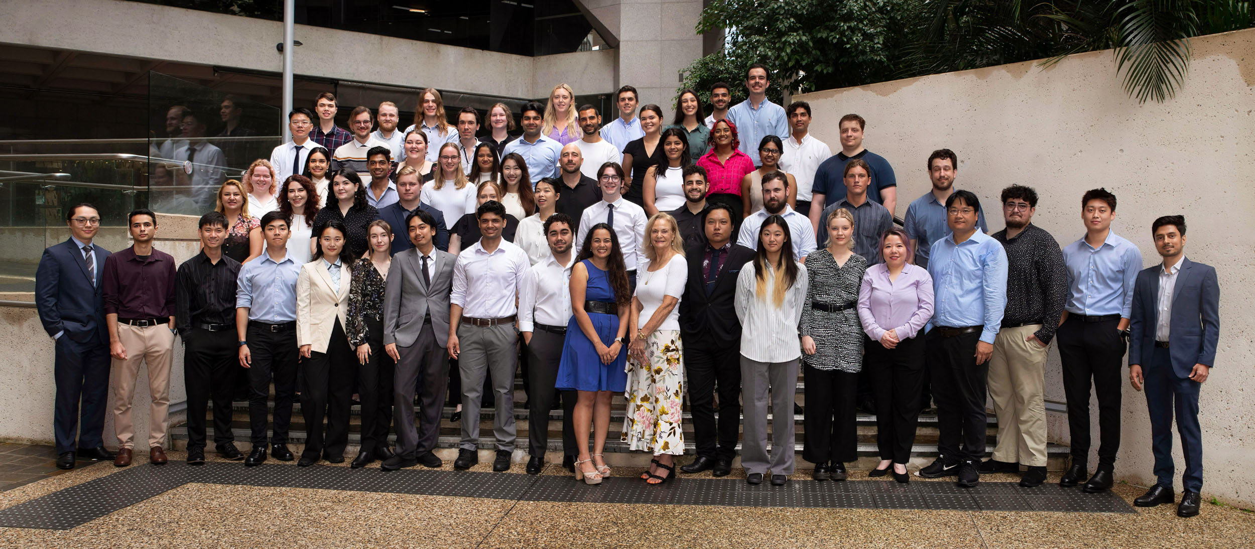 Group of people standing looking at the camera