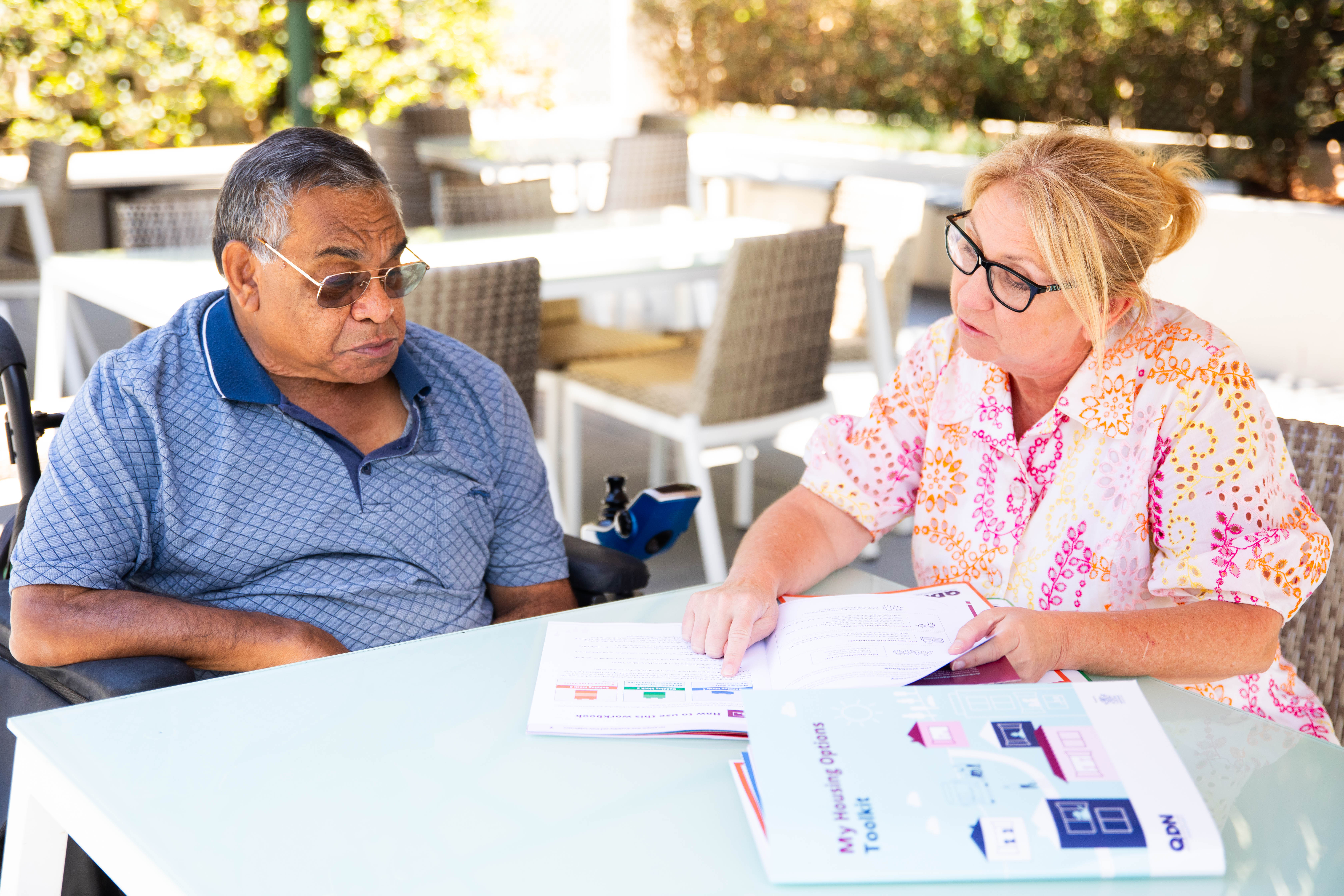 Two people discussing Housing options
