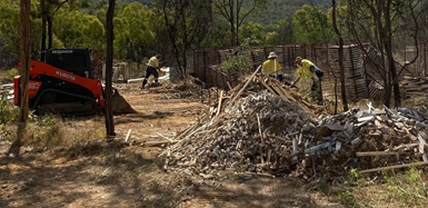 Staff removing drill core trays and other infrastructure from Jumna site